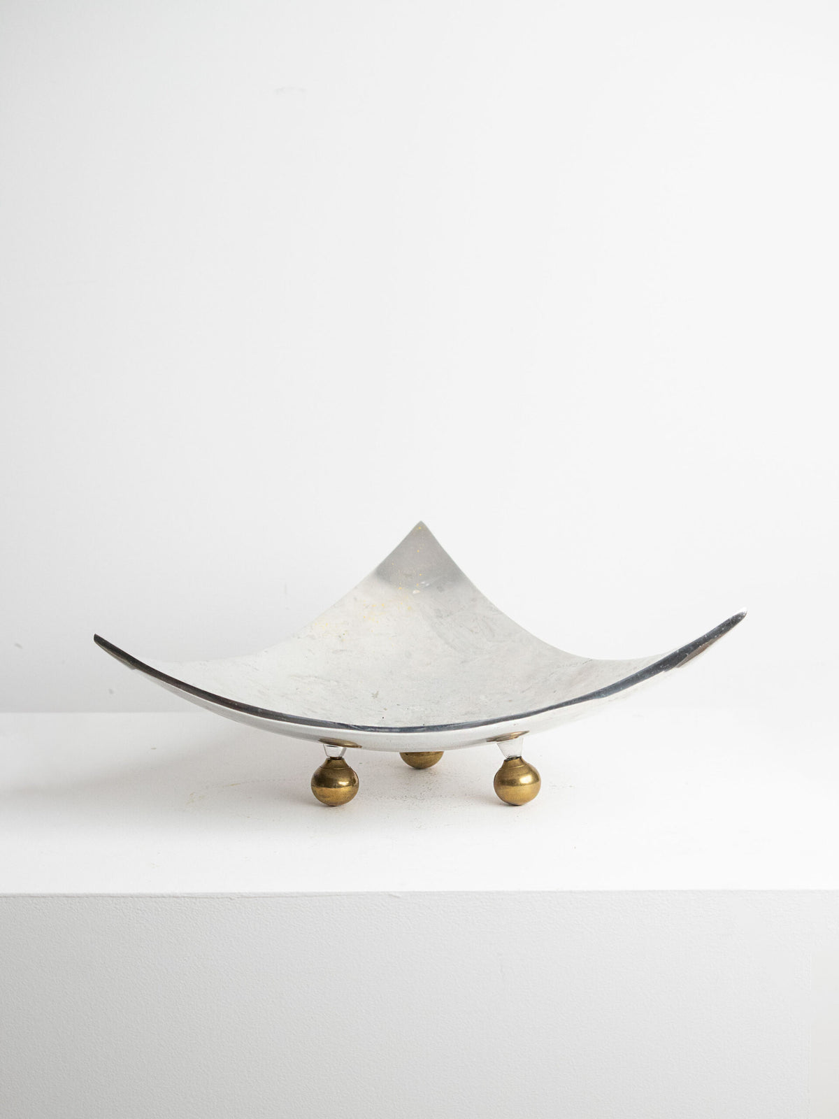Large Four-Point Centrepiece Bowl in Aluminium on Three Brass Ball Feet, circa 1970s to 1980s — lifestyle setting