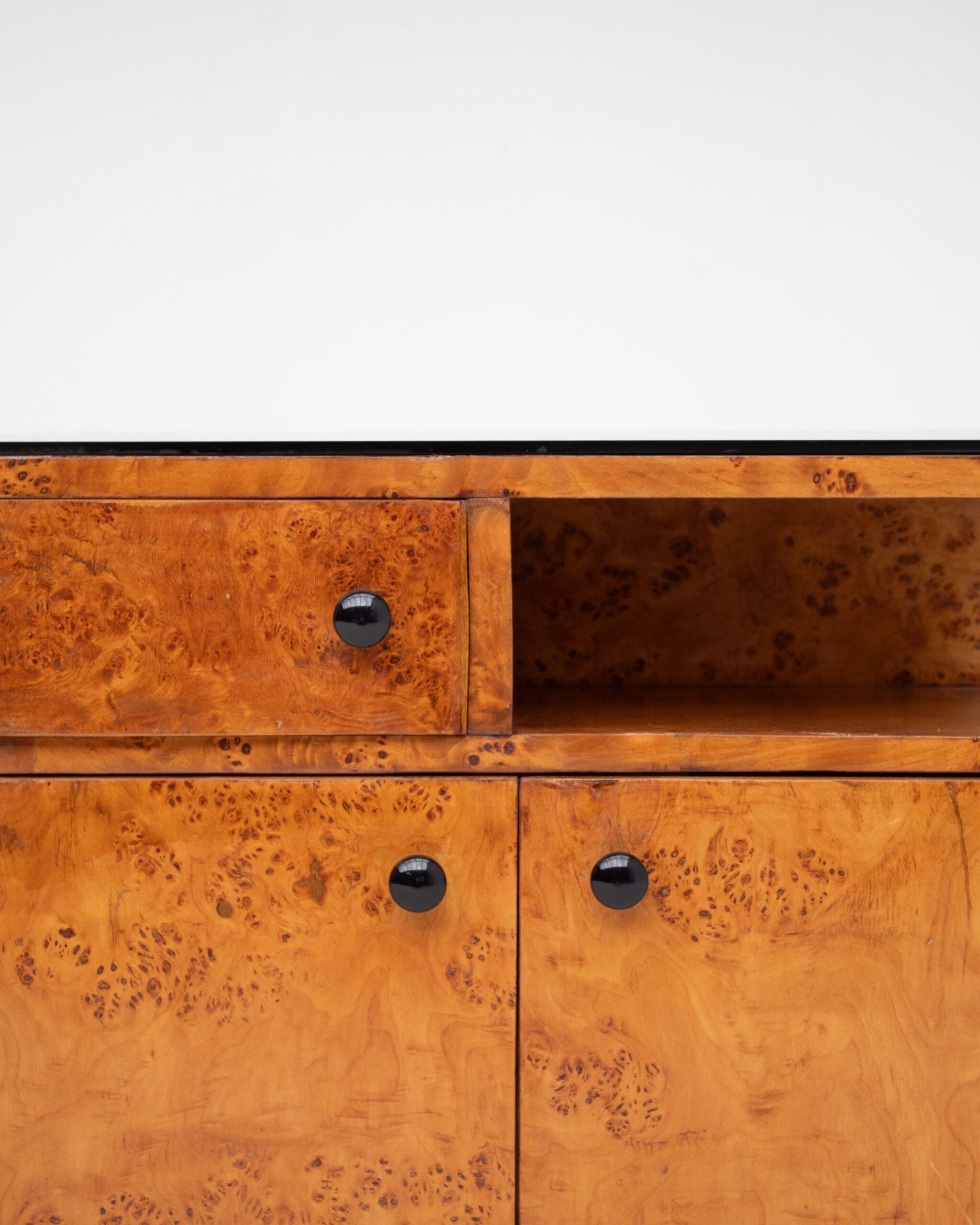 Pair of Art Deco Nightstands in Burlwood — close-up of burlwood texture and black knobs