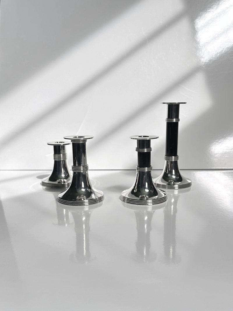 Pair of Silver Plated Candleholders by Gunther Lambert — close-up of candleholders on reflective surface
