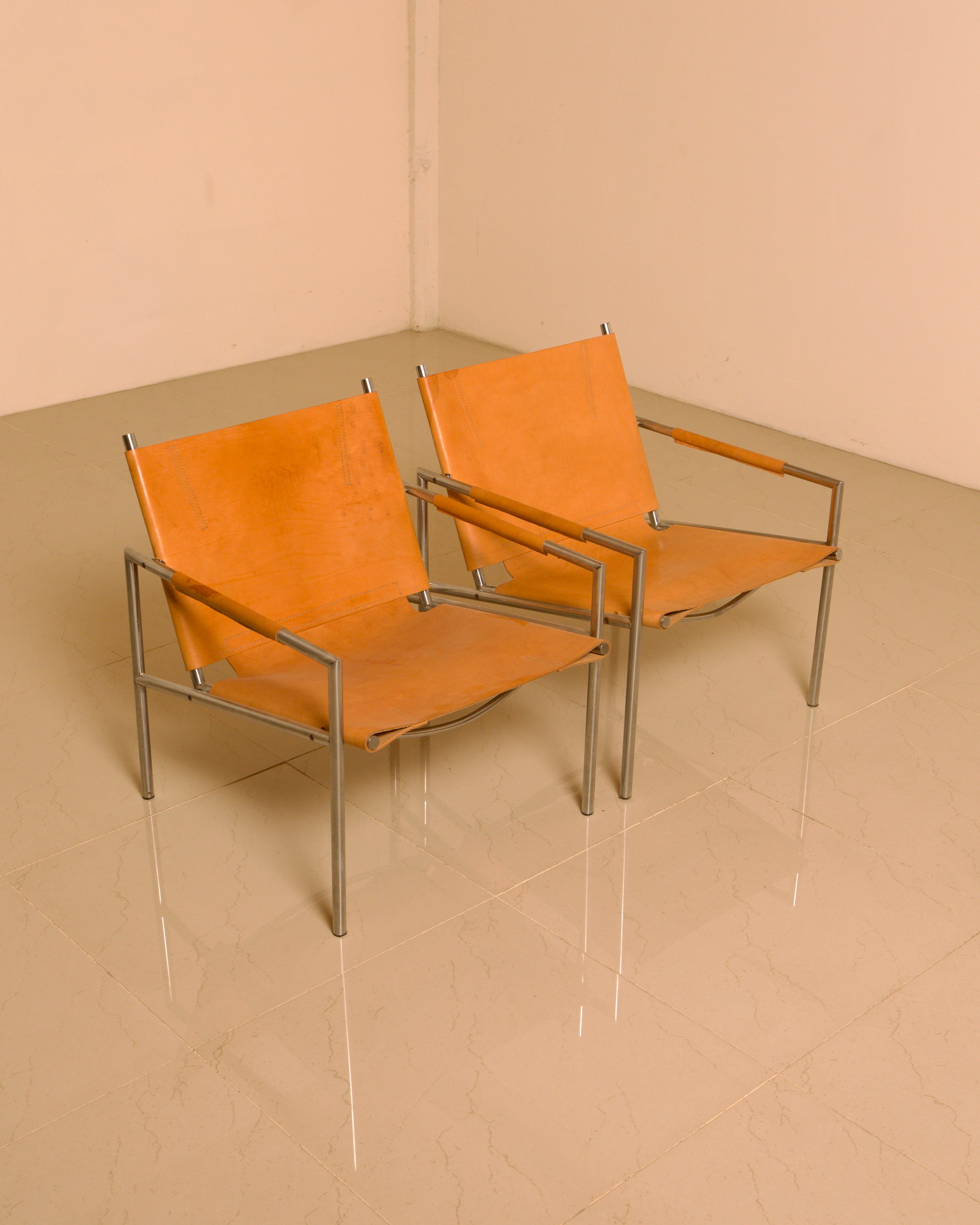Pair of "SZ02" armchairs in natural beige leather by Martin Visser for Spectrum 60's — in context