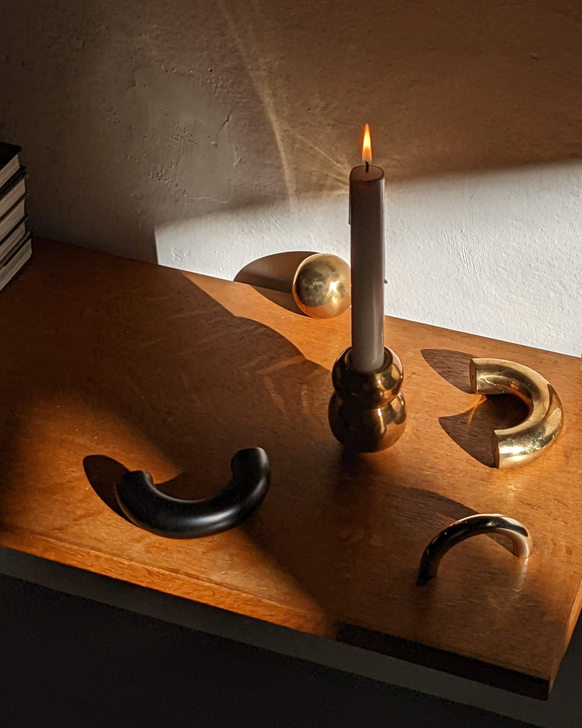 CERCLE Cabinet Knob Large — back view on wooden surface with candle