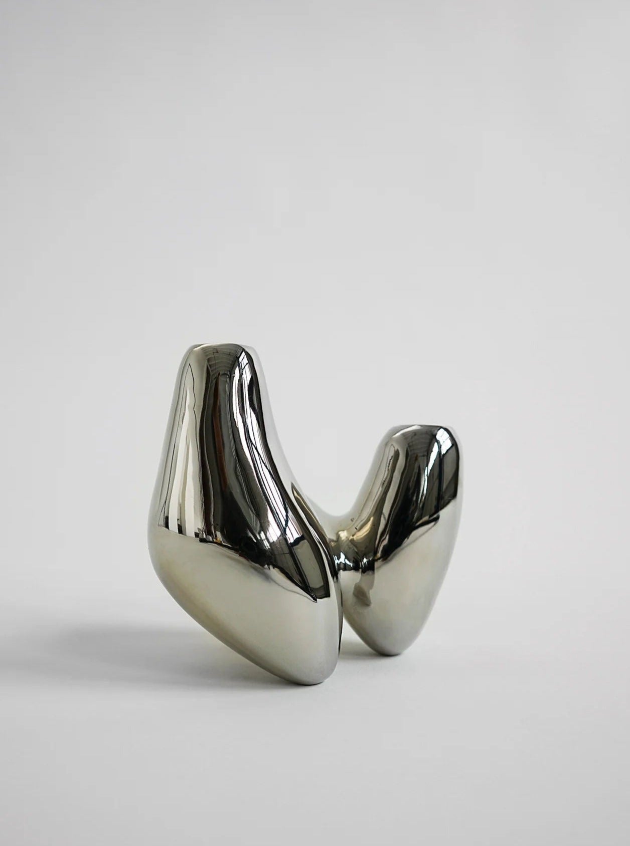 Unity Candleholder - Silver — back view highlighting smooth metallic finish