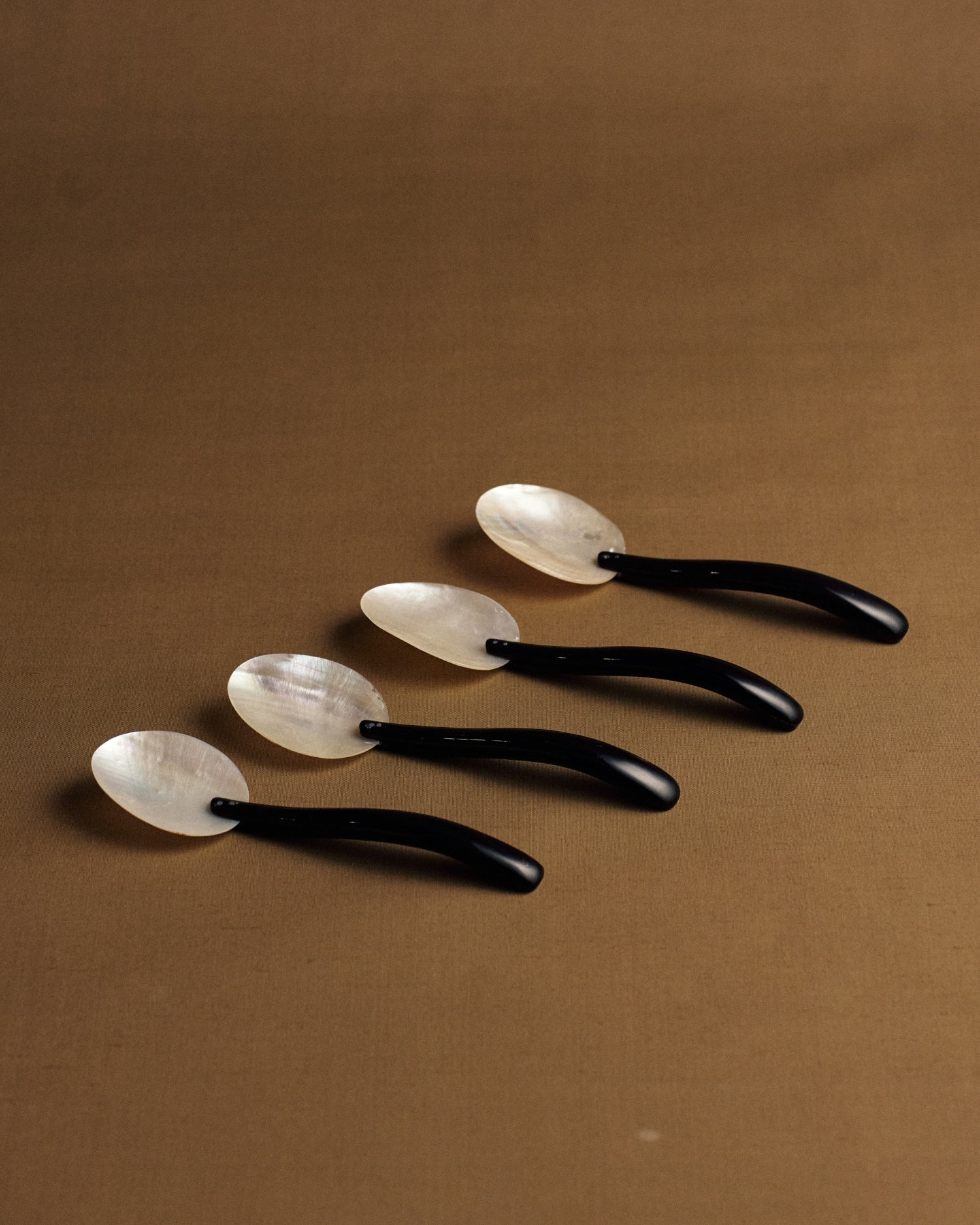 Mother Of Pearl And Bakelite Spoons — detail view