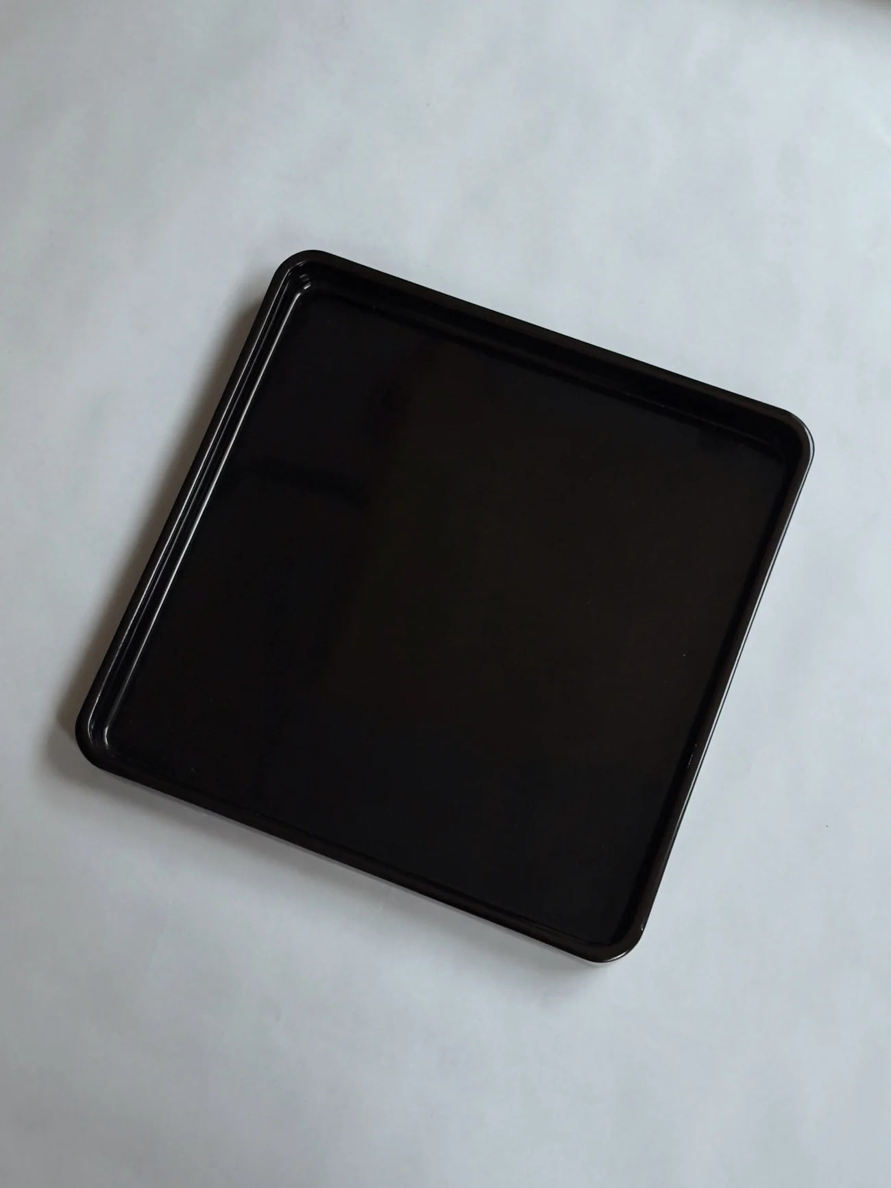 Antique Japanese Lacquer Tray, 1920s — side angle showing glossy black finish