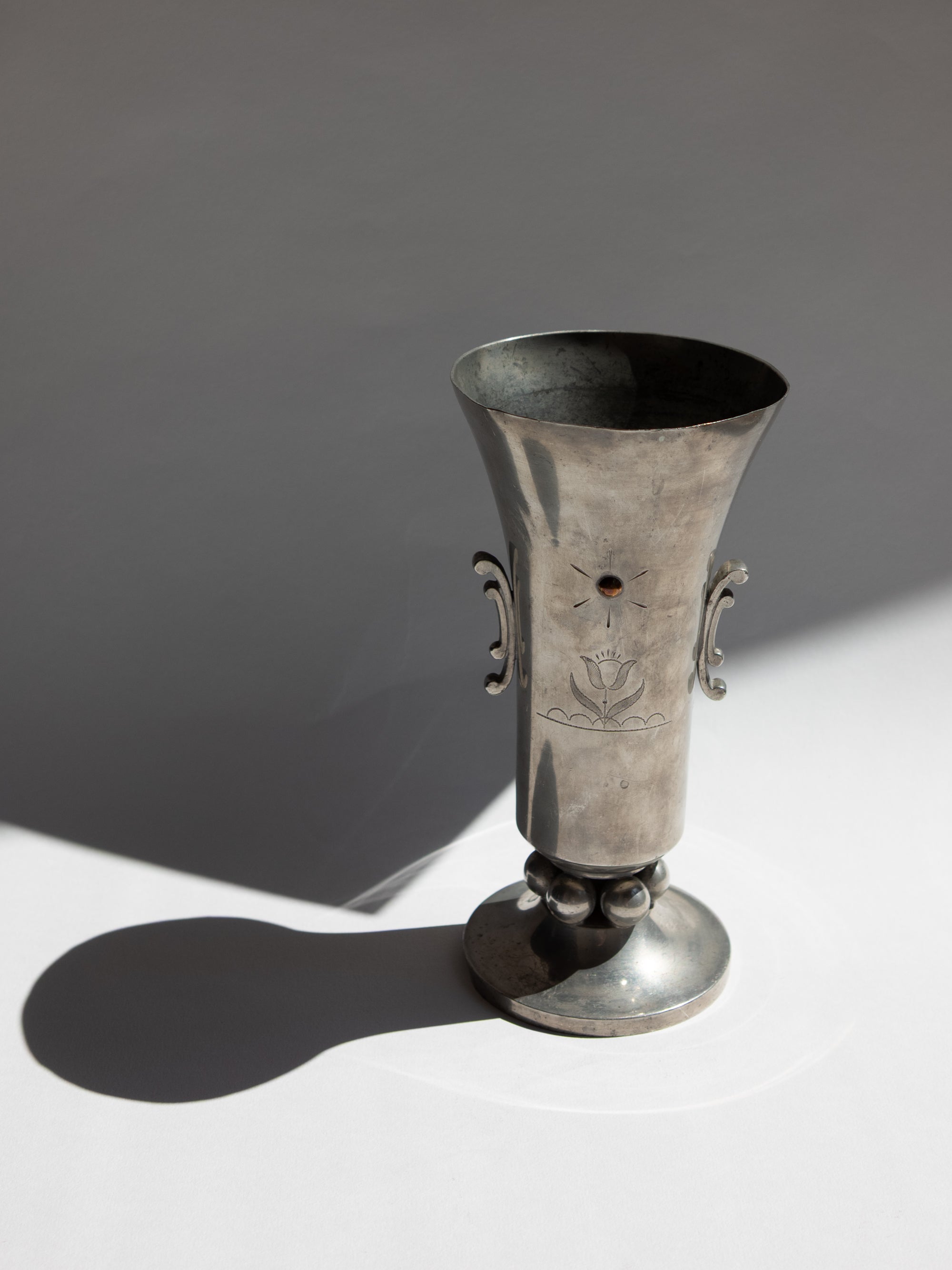 Swedish Grace Pewter Sunburst & Tulip Vase by J.L. Hultman for Svenskt Tenn — in context