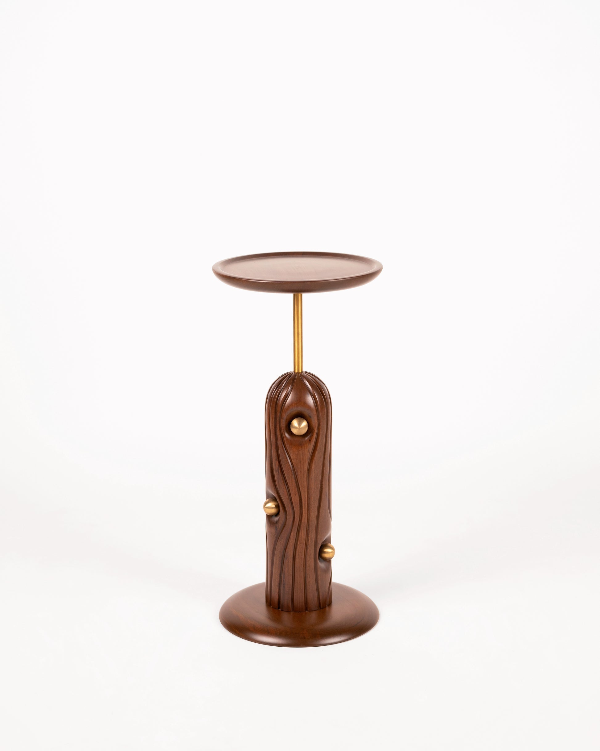 Linea Cocktail Table — side angle showing wooden base and brass accents
