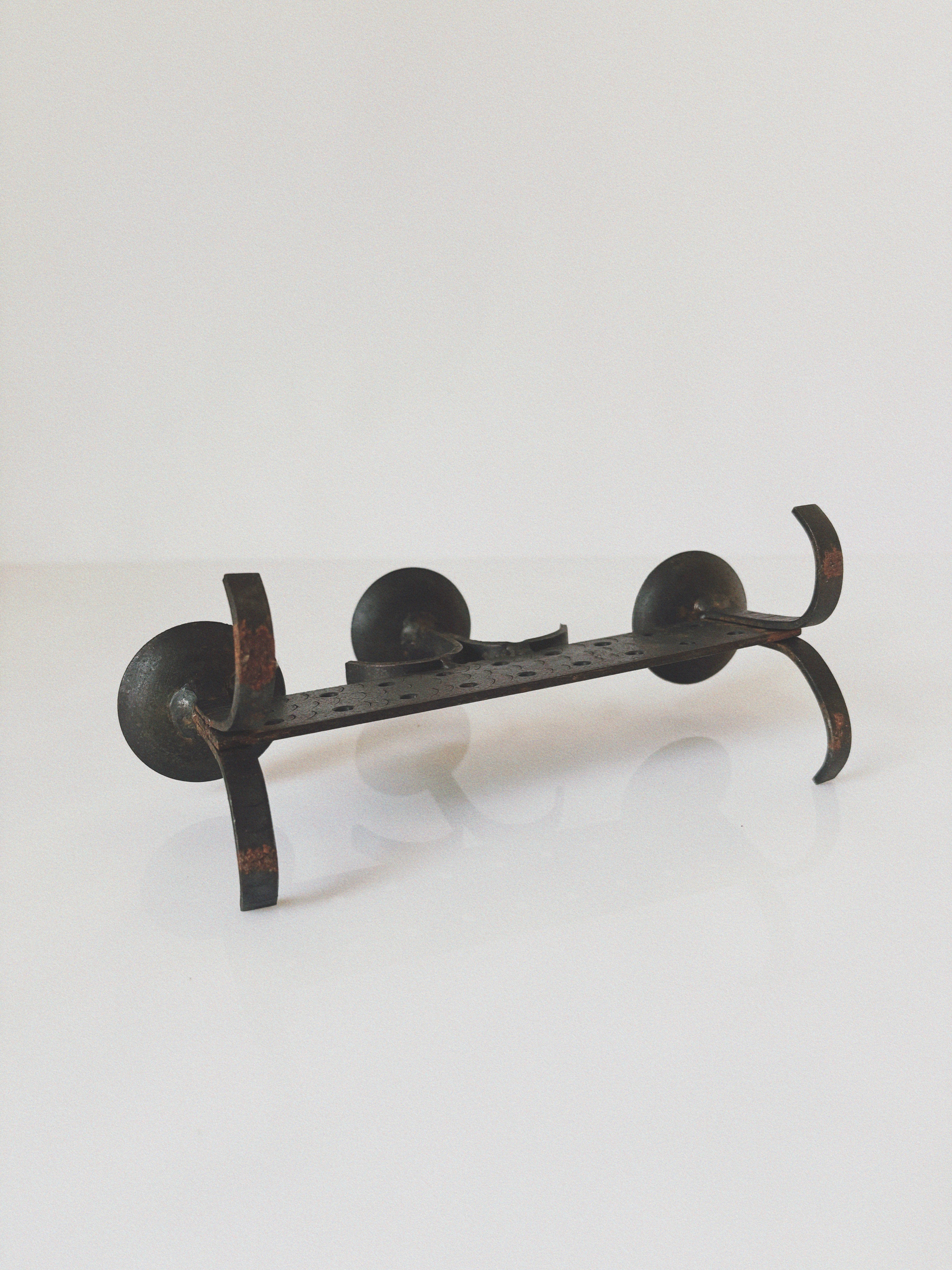 Geometric Hand Forged Metal Candlestick, Mid Century Poland — lifestyle setting