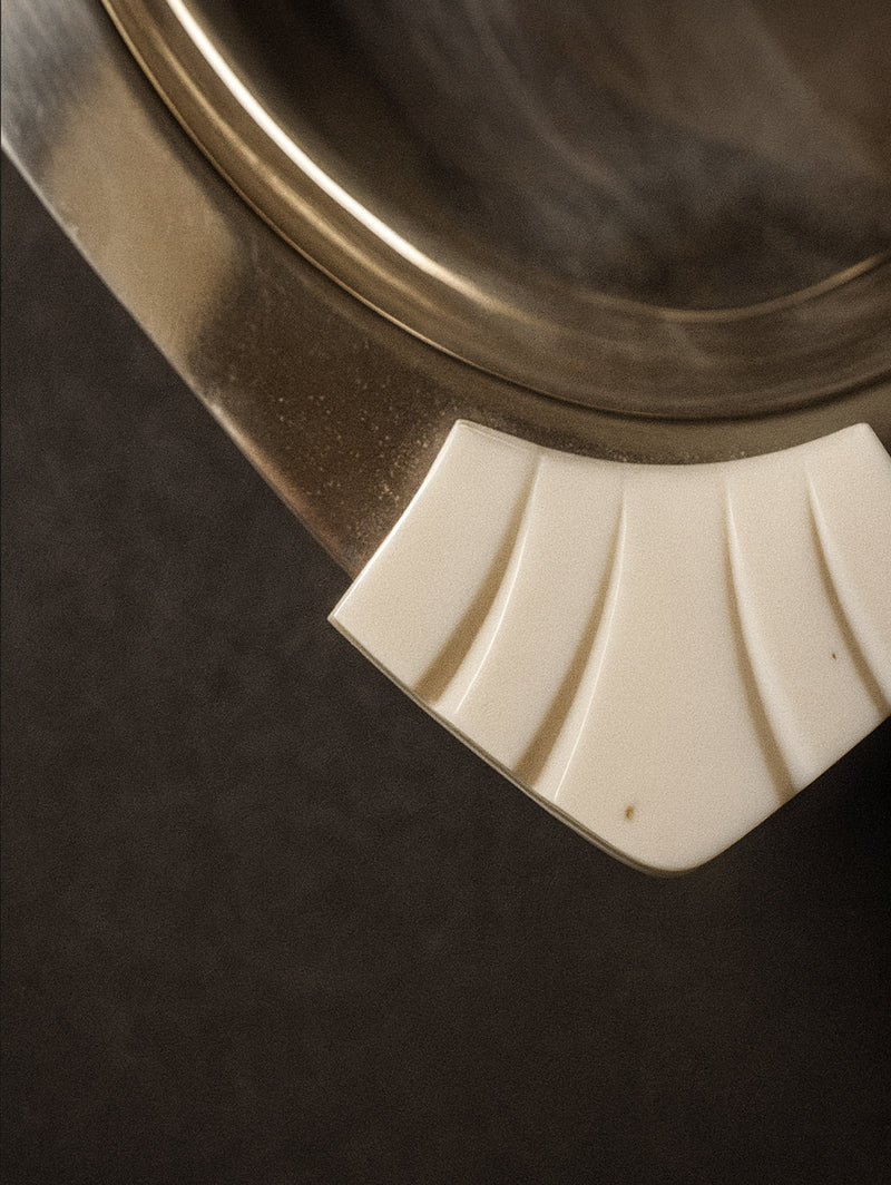 Art Deco plate detail showing white Bakelite grip handle, 1930s