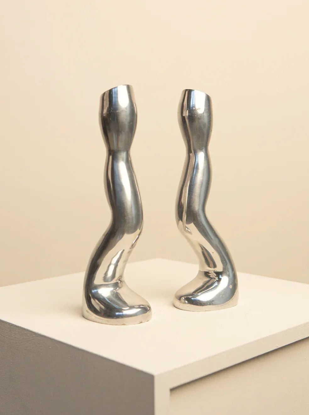 Two 80's style candleholders in cast aluminium with biomorphic design