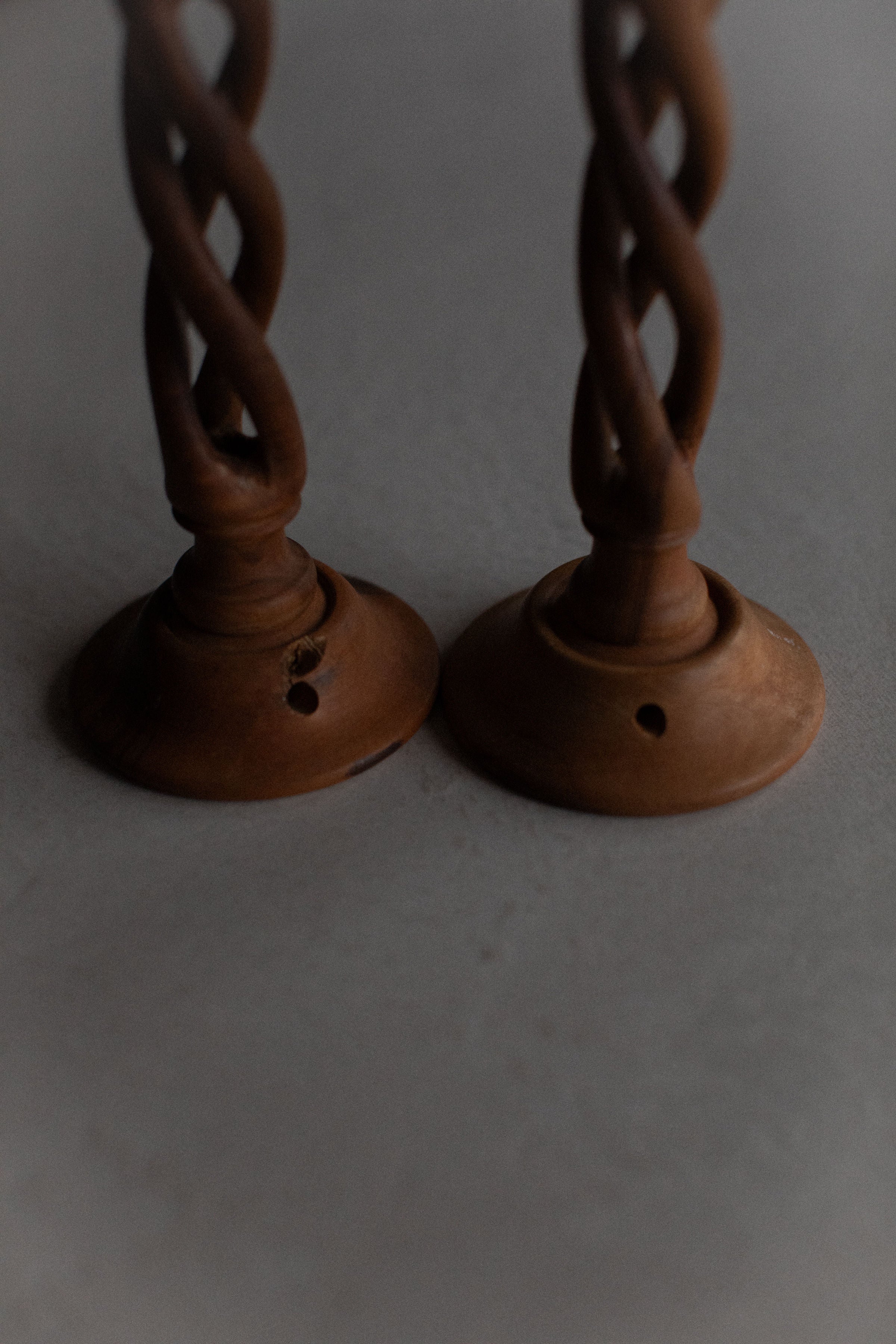  Set of three wooden candleholders in different heights and natural wood grain