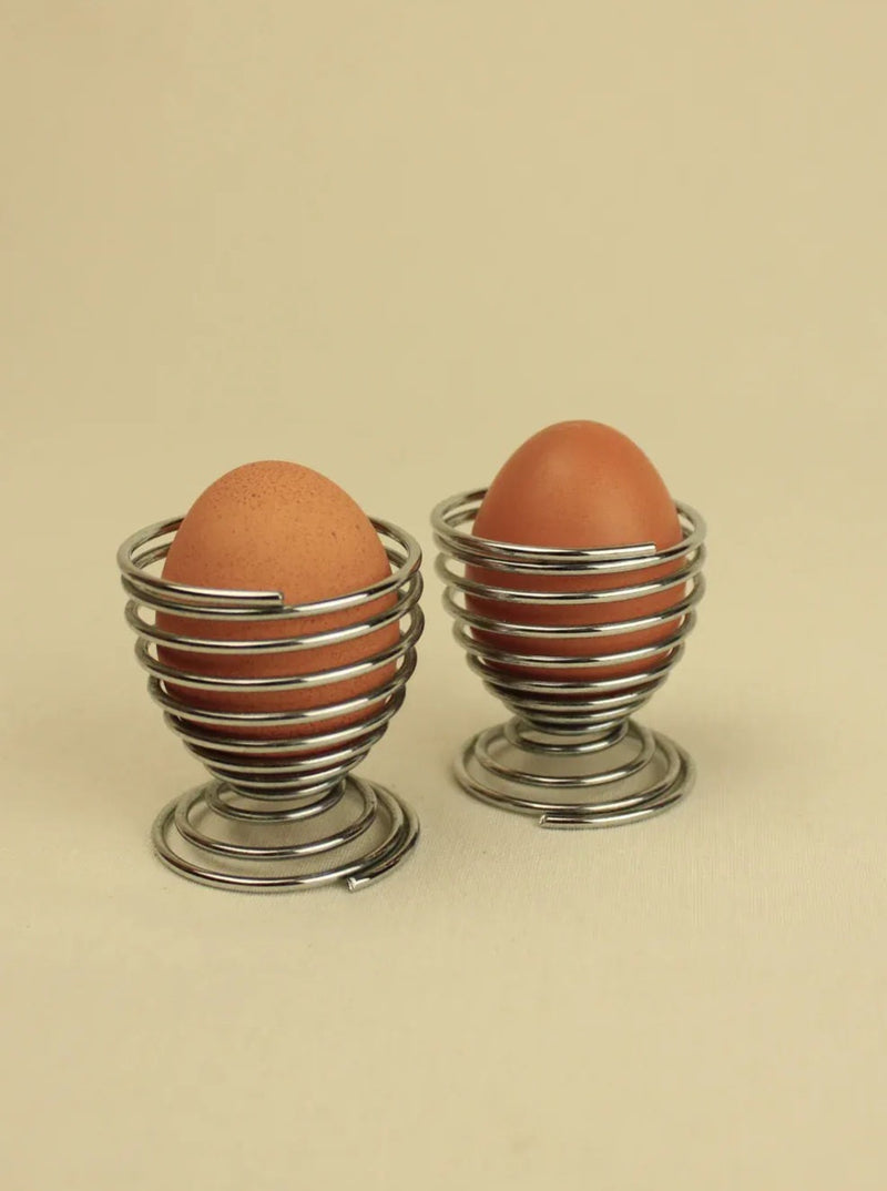 ###
Set of 3 ceramic egg cups in white, blue, and yellow swirl pattern