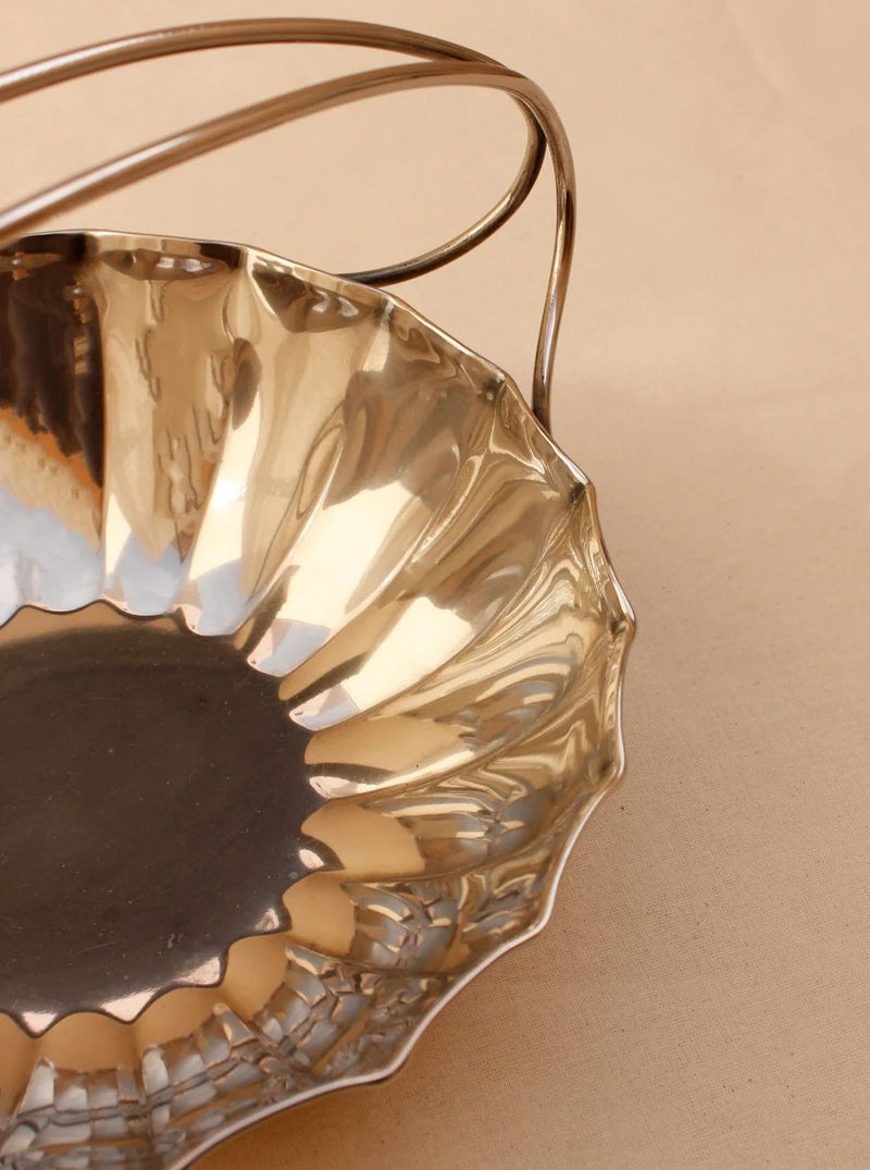  Elegant and ornate silver-plated fruit bowl with decorative handles