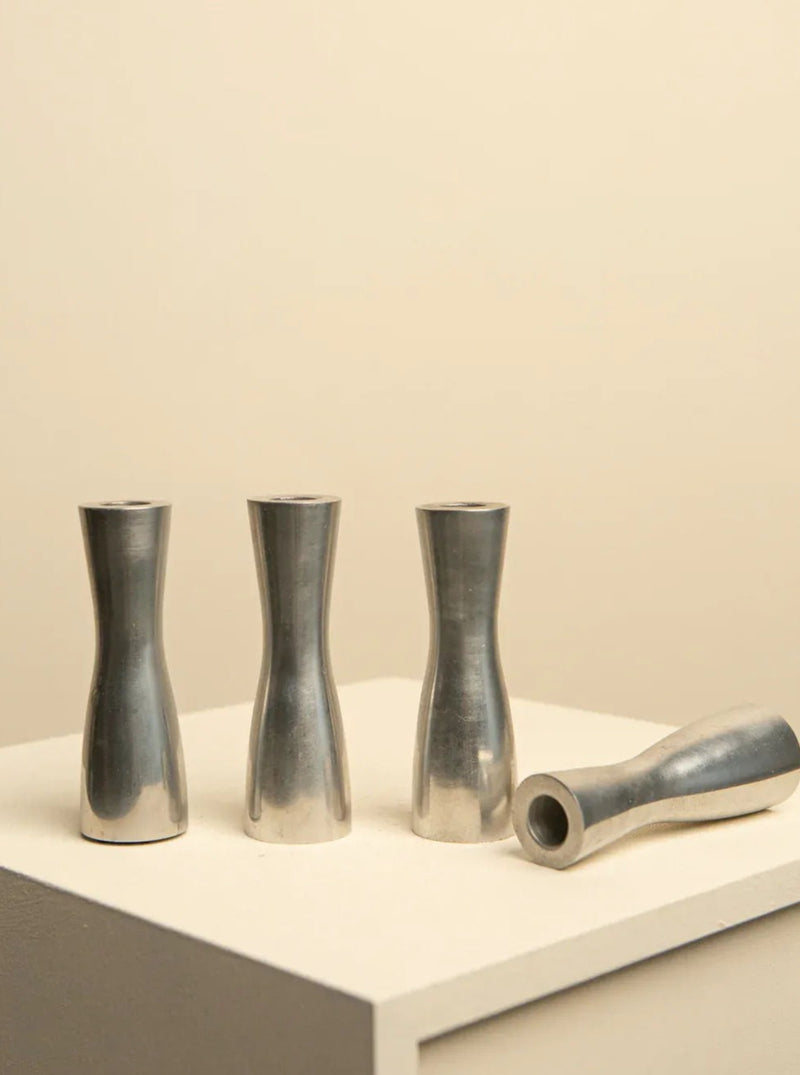 Vintage set of three chrome-plated candleholders, designed by Erika Pekkari in the 1990s, featuring sleek and modern design with a reflective finish