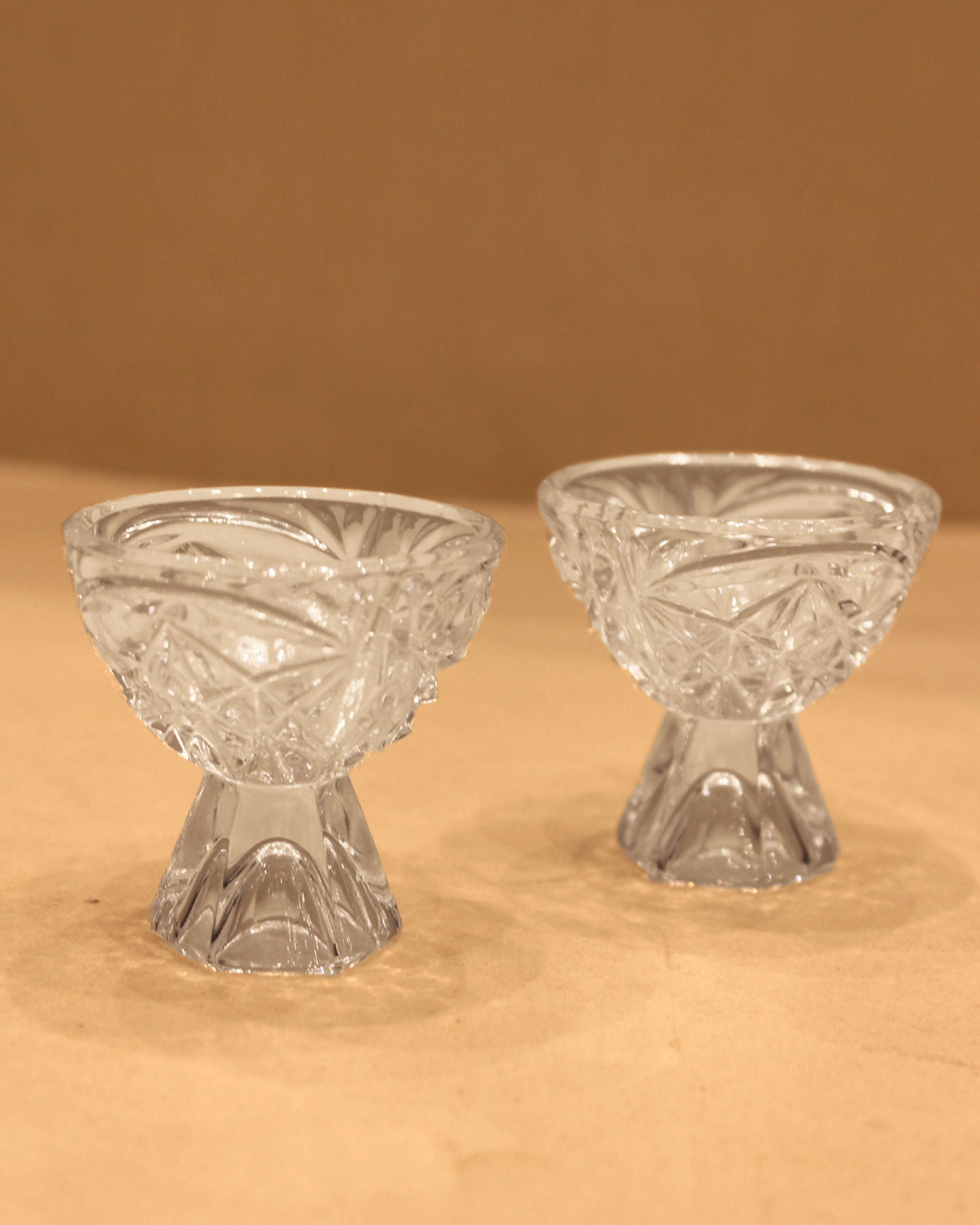 Engraved crystal liqueur glasses with intricate designs and elegant craftsmanship