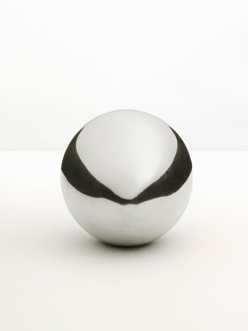  Round Silver Paperweight with elegant design and shiny surface