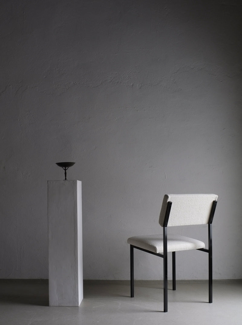 Vintage 1960s white bouclé upholstered chairs with sleek black metal frames