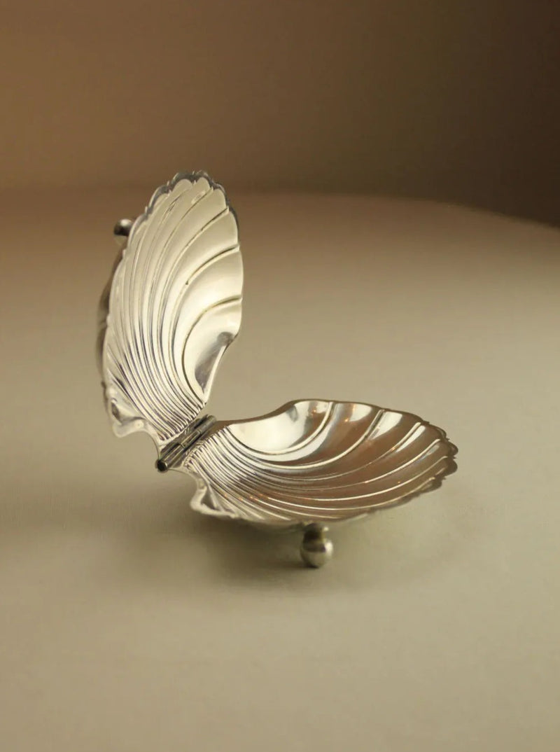 Beautiful handcrafted shell shaped jewelry box with intricate details and gold accents