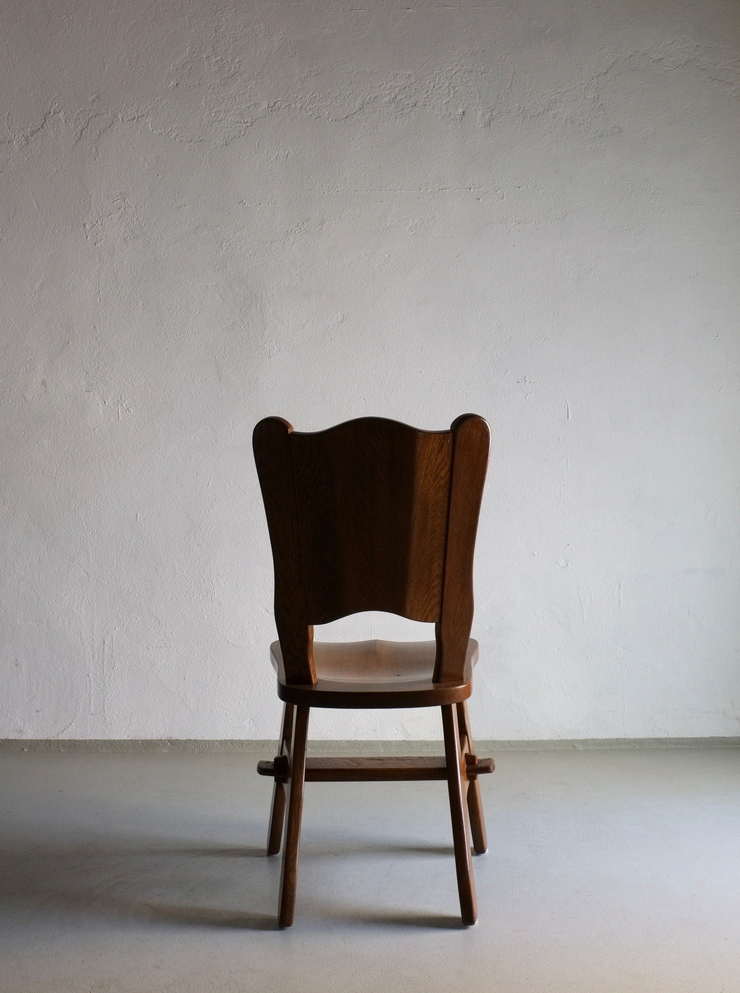 Mid-century modern Brutalist chairs with intricate oak details