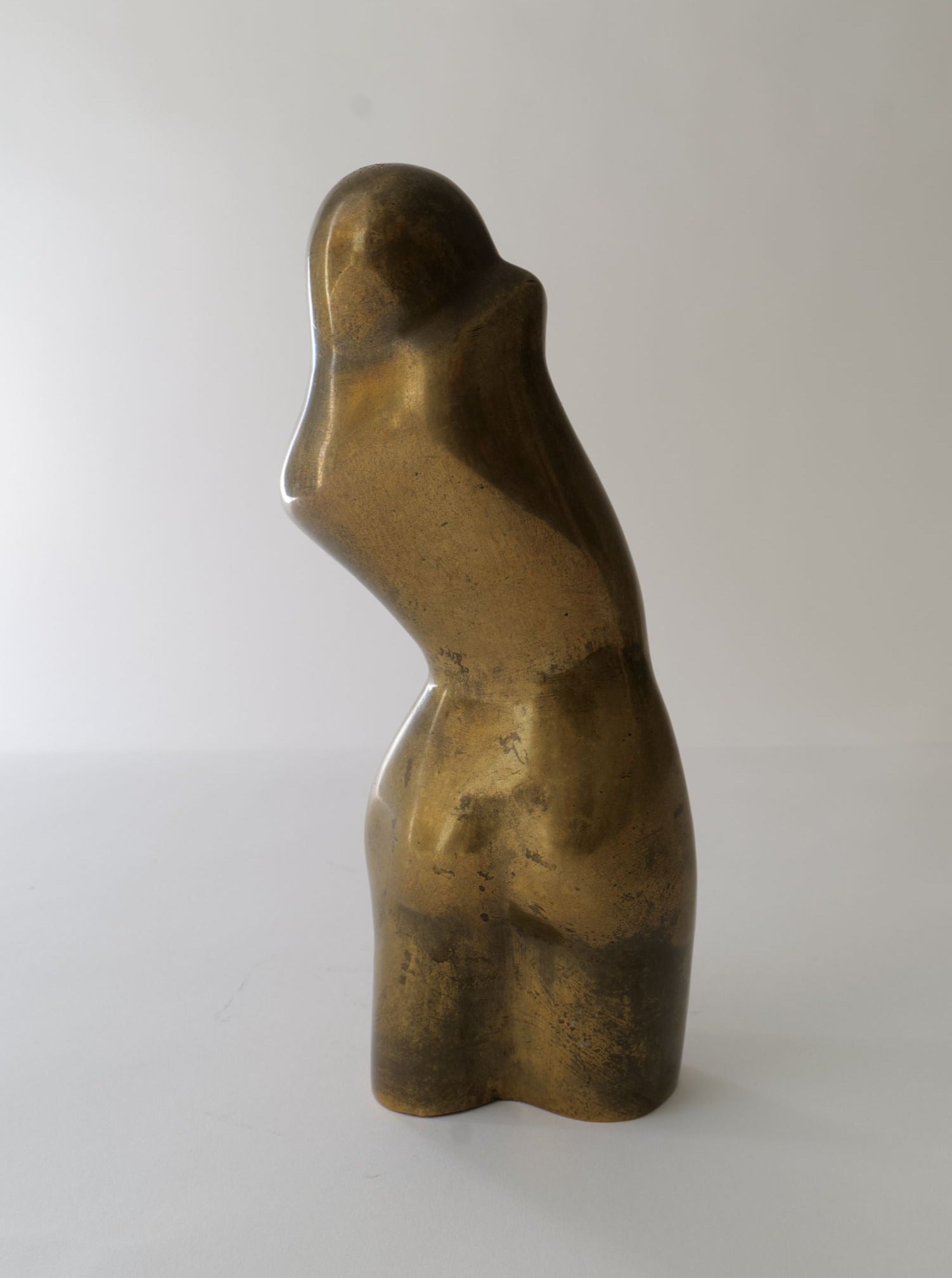 Bronze figurine sculpture of a mother and child embracing in tender moment