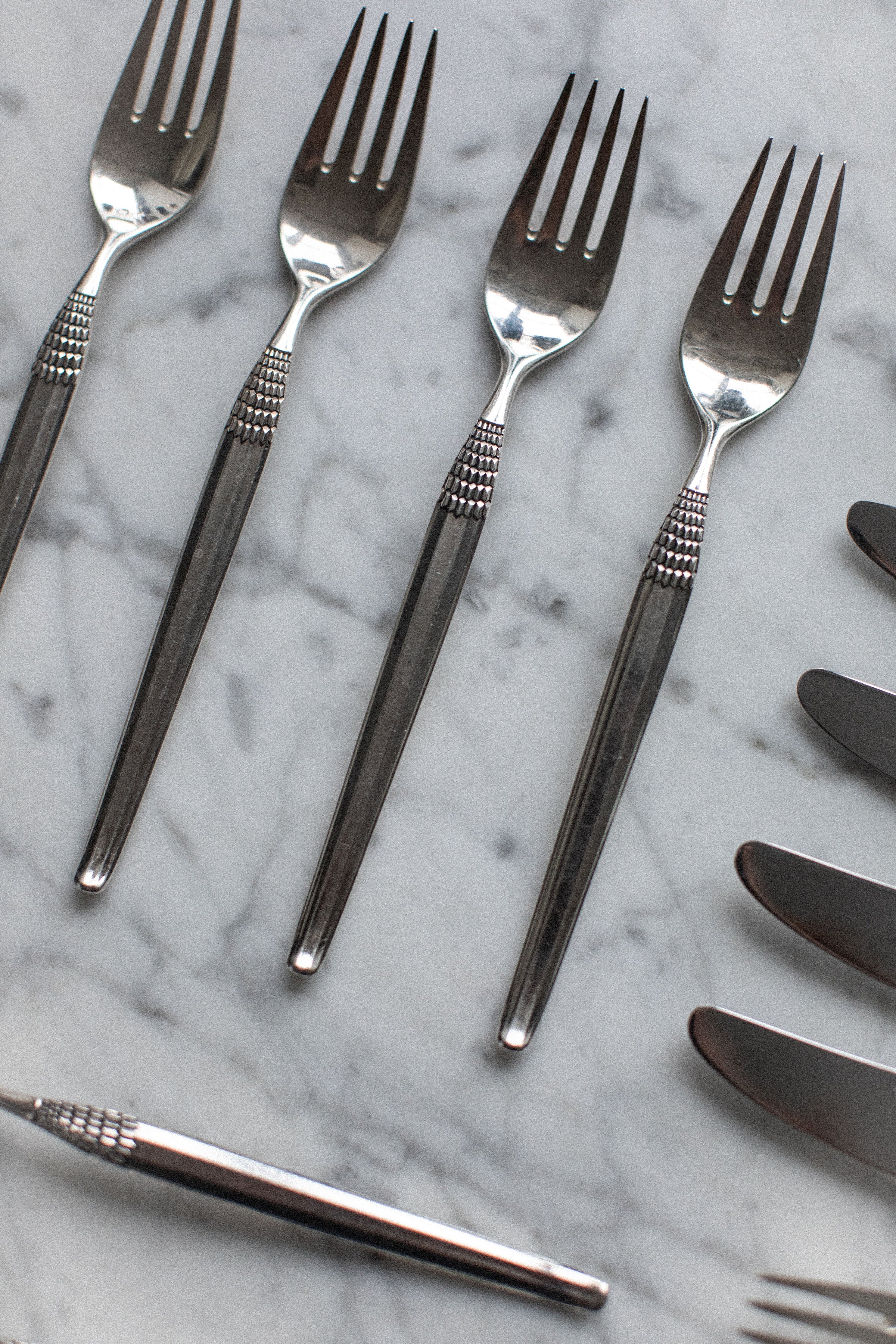 Art Deco Cutlery pieces arranged to highlight the exquisite, ornate patterns