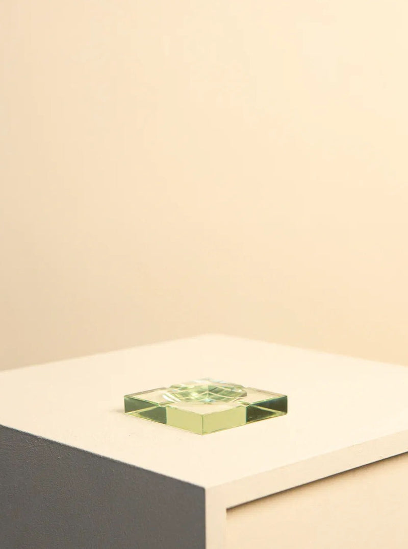 Fontana Arte square glass ashtray from the 60s displayed on a white tabletop