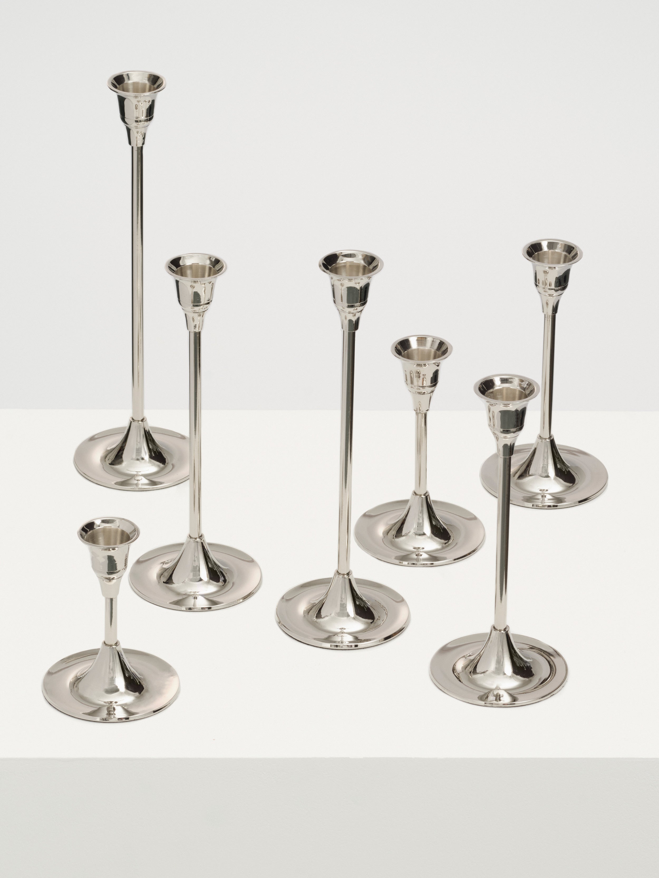  Set of three candlesticks in different heights for a stunning display