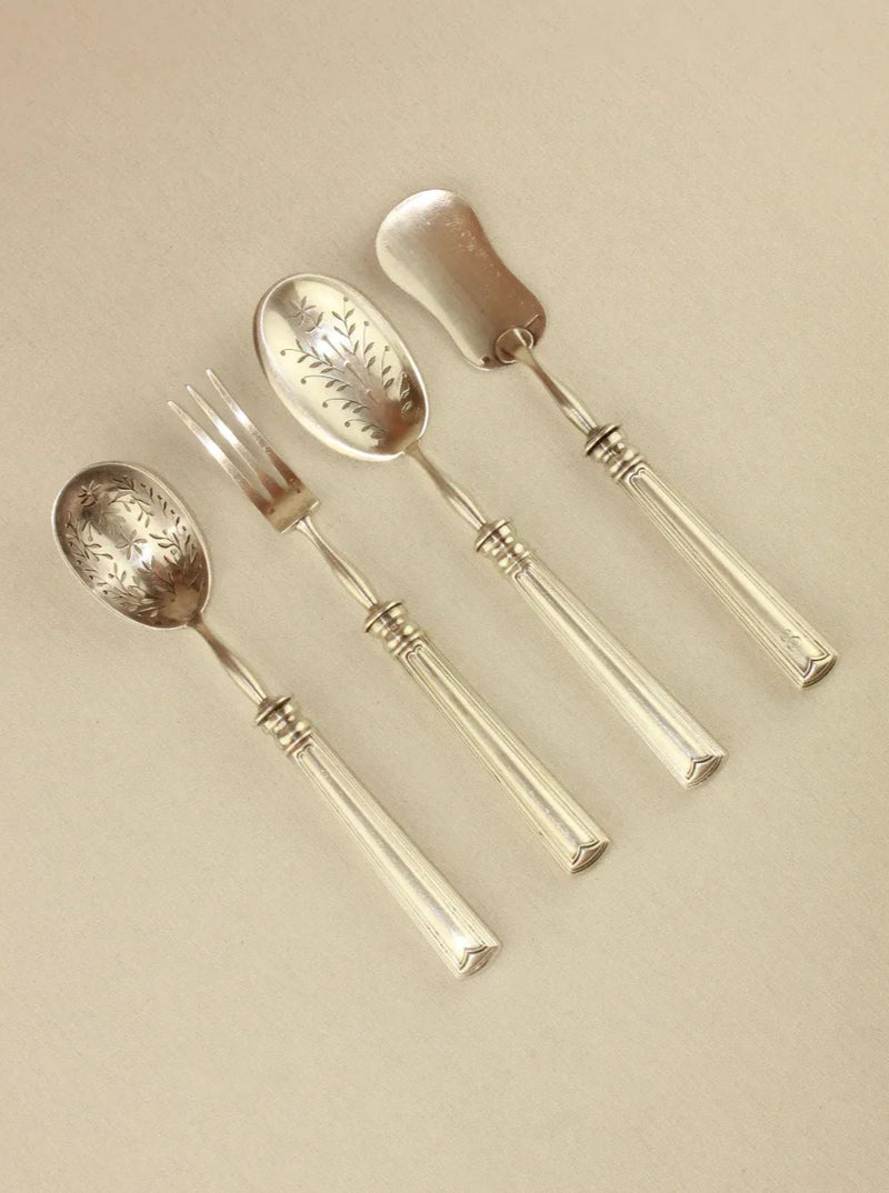 Elegant silver-plated metal cutlery set with ornate handles