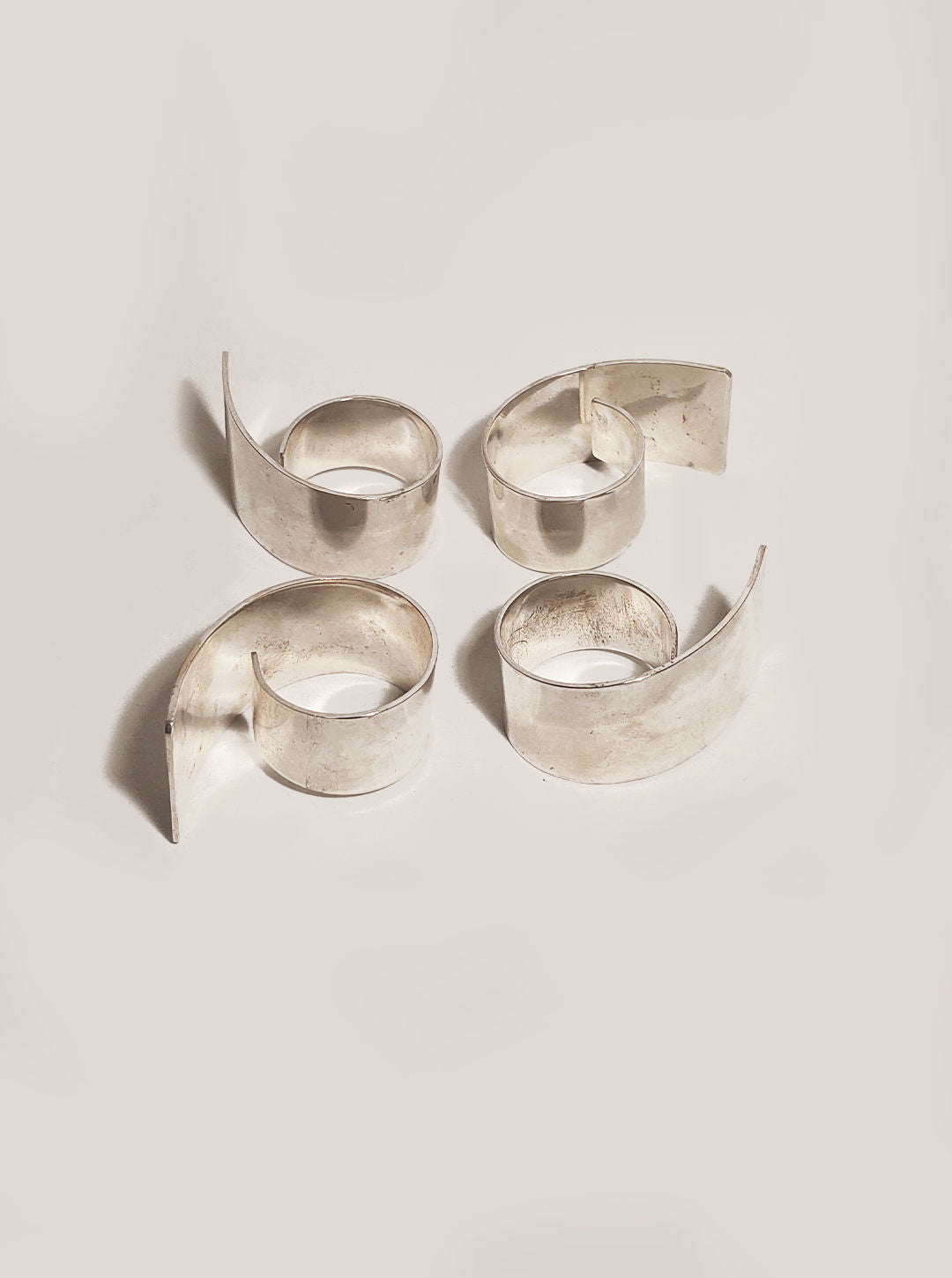 Four napkin rings featuring a beautiful and timeless design