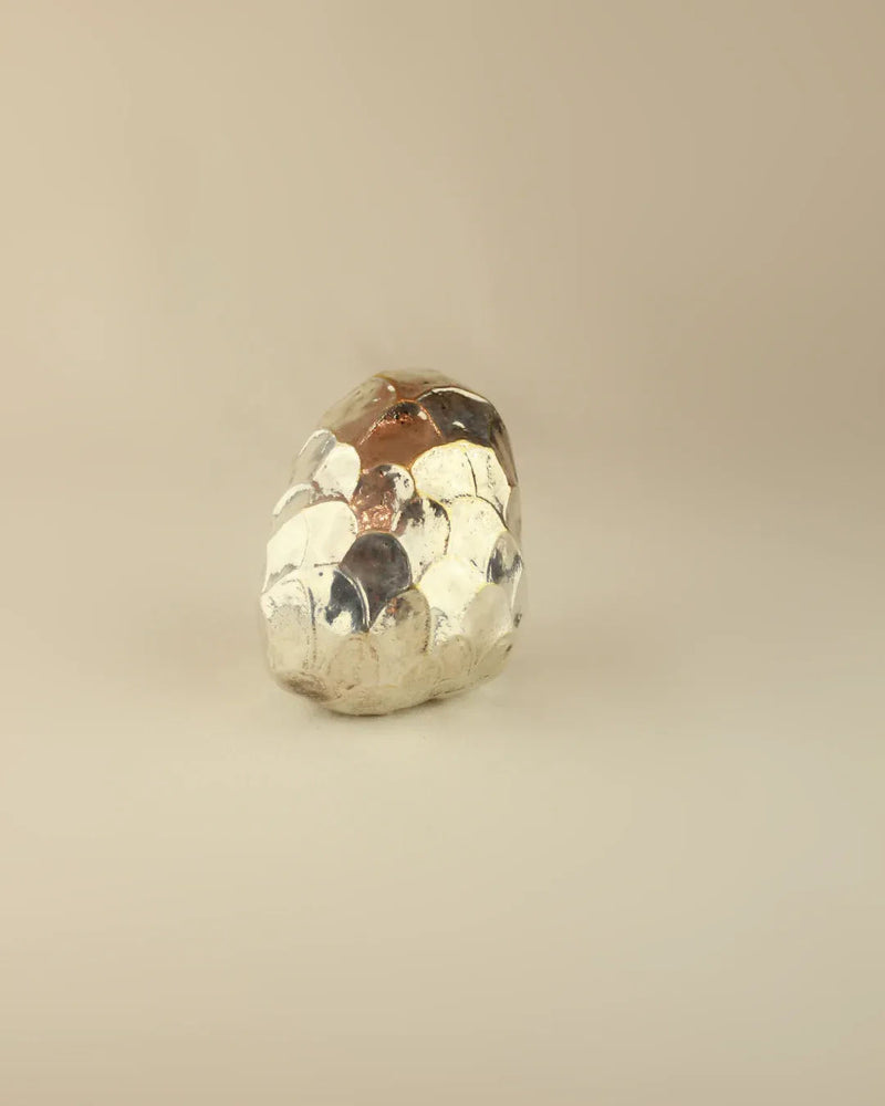  Artisanal silver custard apple ornament with lifelike texture and realistic appearance