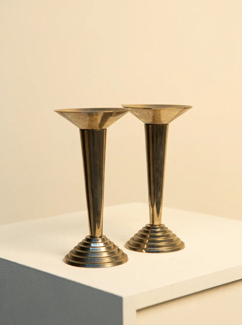 Pair of vintage 1980s Italian candleholders in Art Deco style, featuring geometric patterns and sleek, polished metal finish