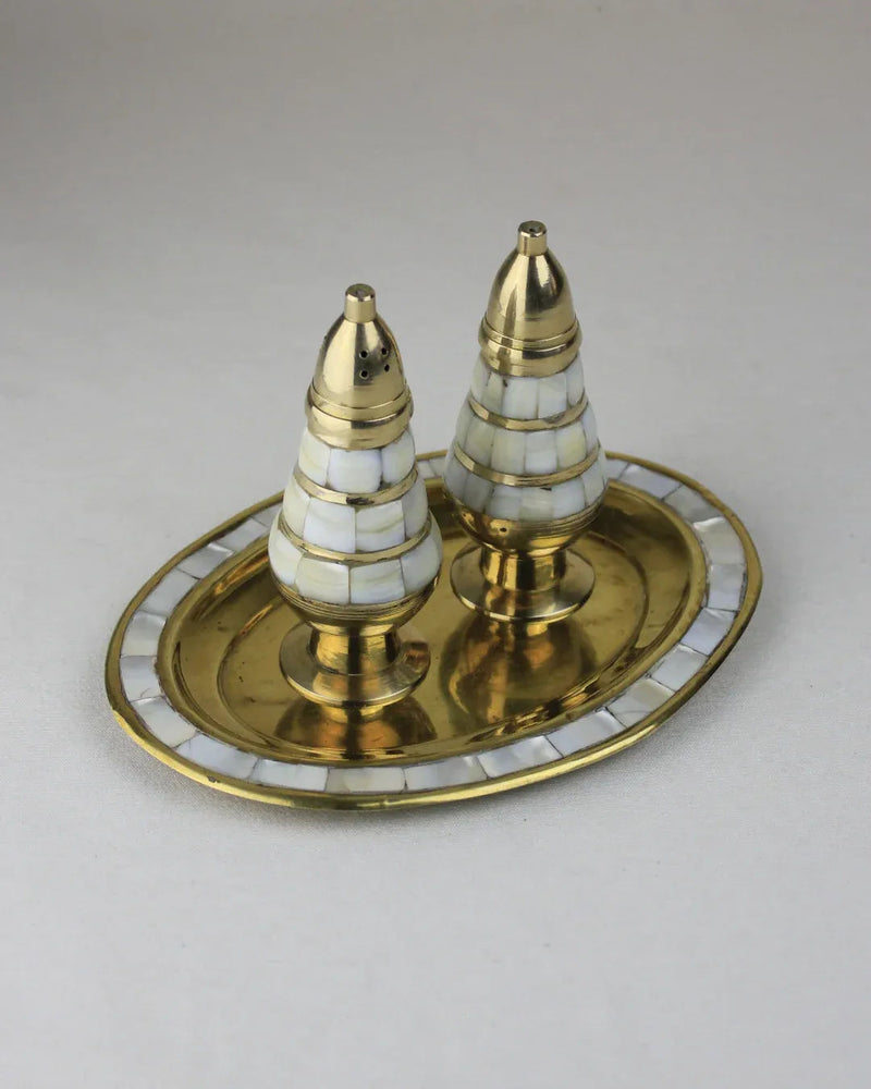 Elegant Mother of Pearl Salt and Pepper grinders on a dining table