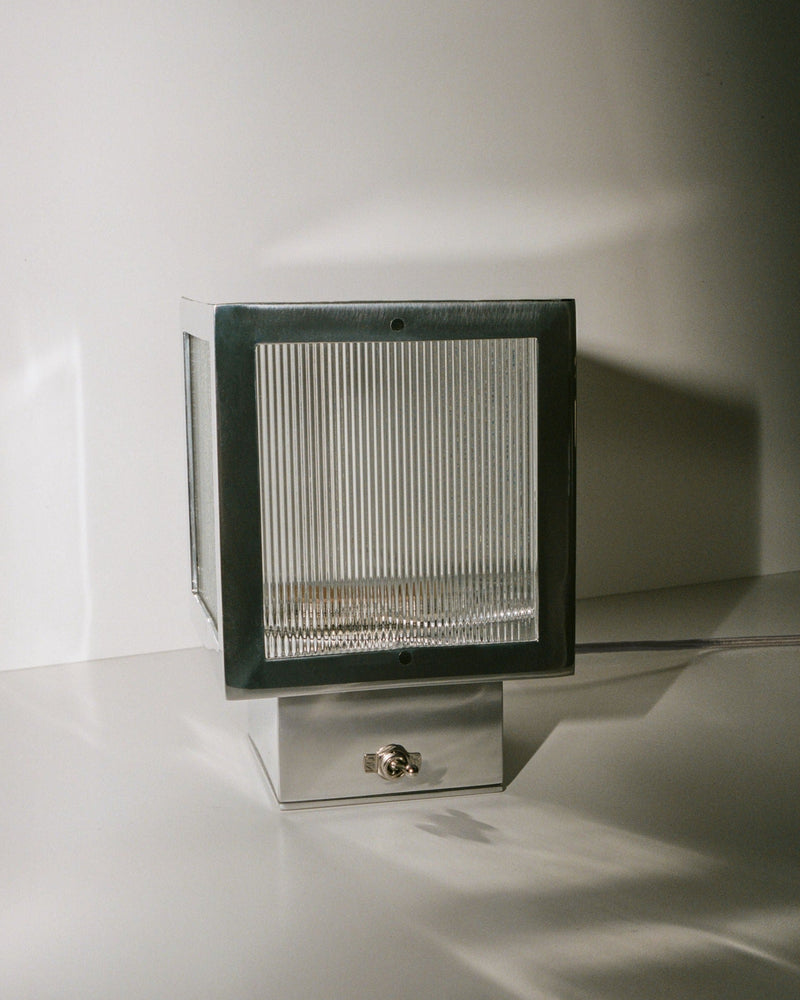 Modern black table lamp with adjustable arm and white lampshade