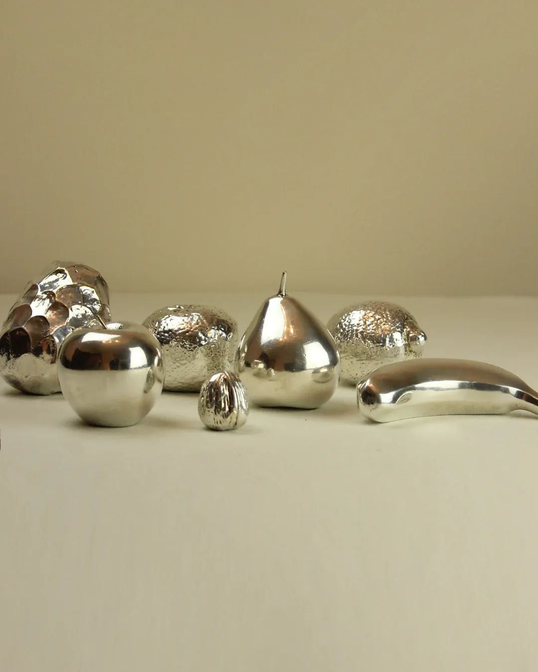  Silver banana sculpture with sleek and minimalist design, perfect for contemporary decor