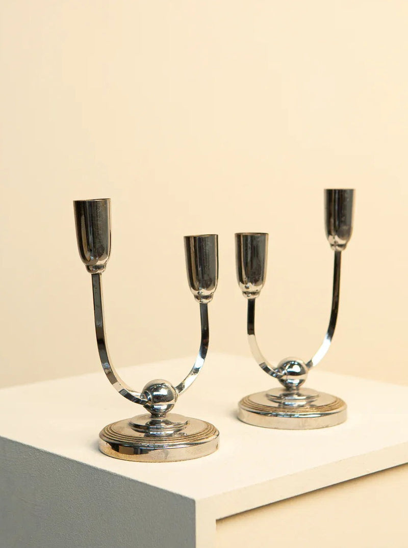 Pair of mid-century modern candleholders made in Italy, featuring a unique U shape and a sleek, timeless aesthetic