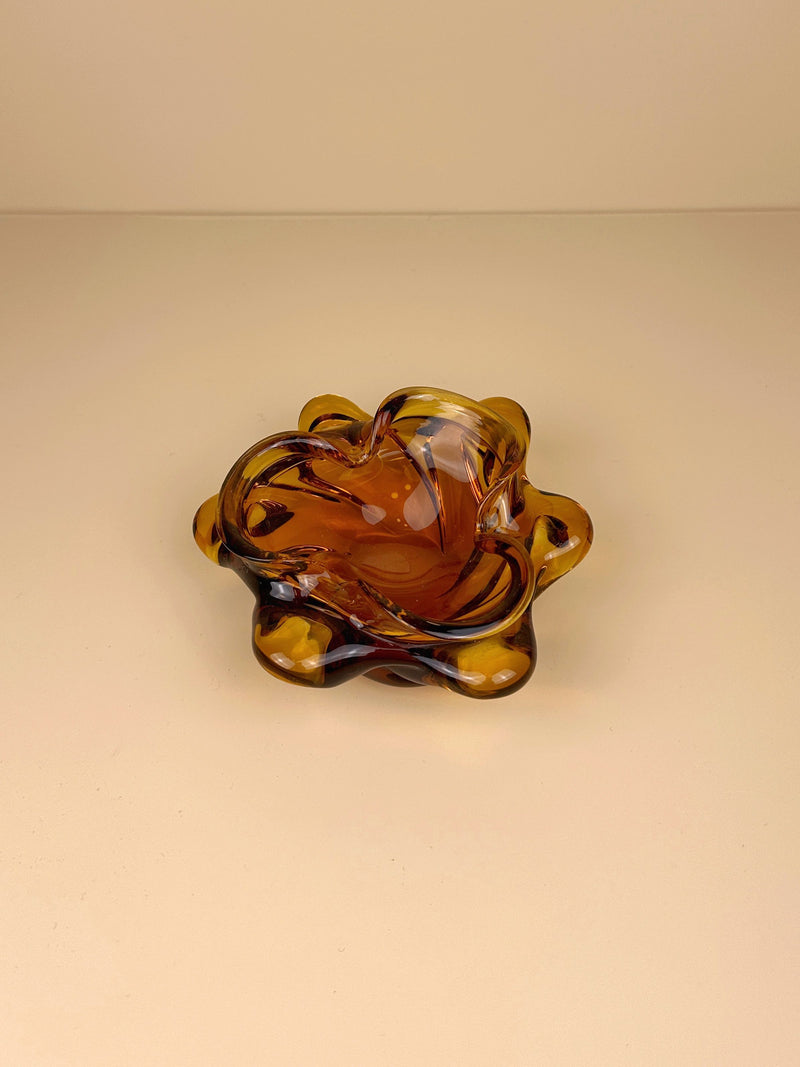  Retro amber coloured ashtray with a unique round shape and textured surface