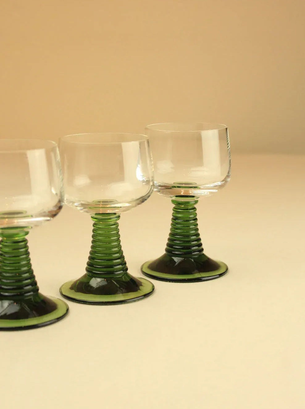 Set of four Roemer glasses featuring unique grapevine etching and sturdy base