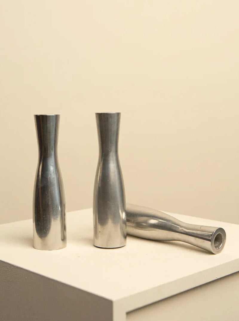 Vintage set of three chrome-plated candleholders by Erika Pekkari from the 90's, featuring sleek and modern design elements