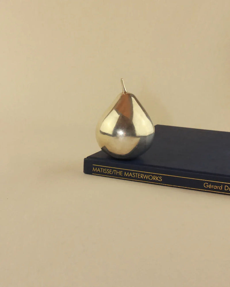 Handcrafted silver pear sculpture, a beautiful and unique home decor accessory