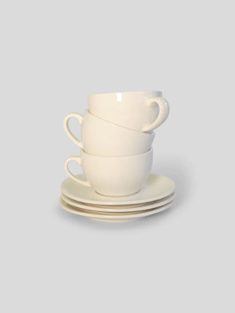 Three white ceramic Service Projects Marlow coffee cups stacked on top of each other, accompanied by matching saucers, all set against a light gray background.