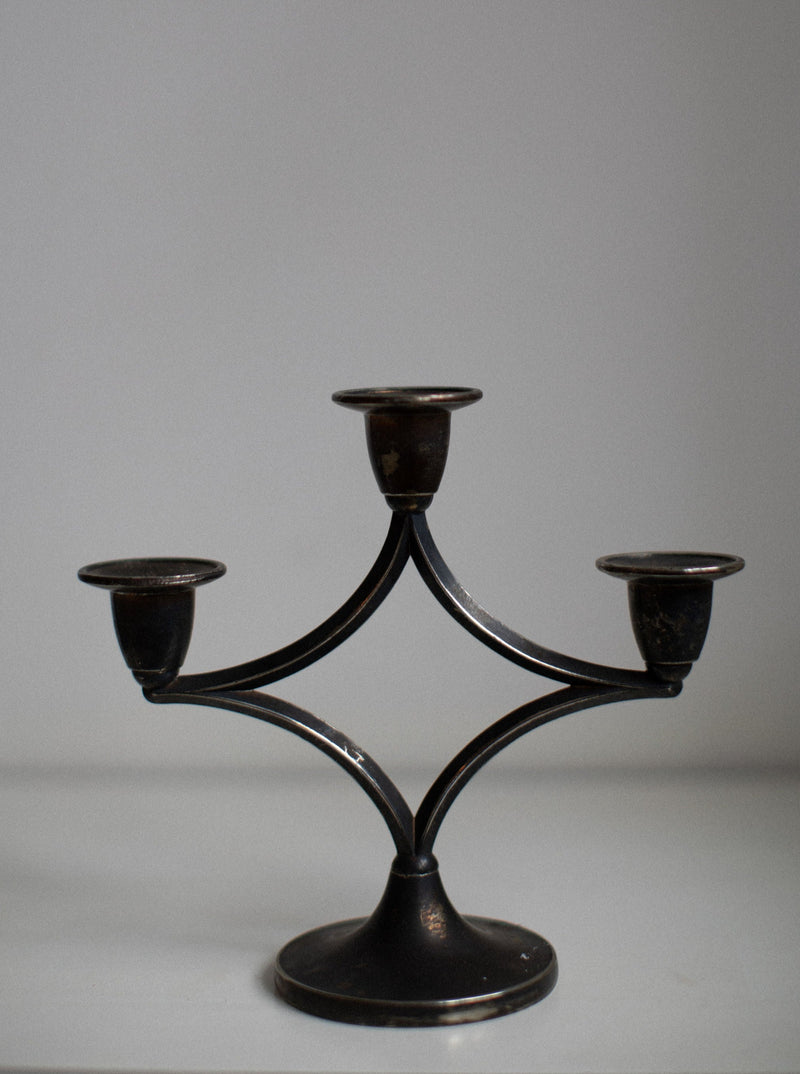 Beautiful dark silverplated candleholder with intricate floral design and smooth finish