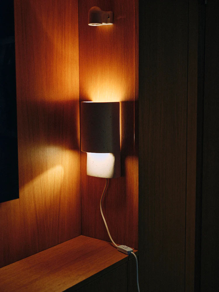 Modern wall light in natural white color, perfect for illuminating your home decor