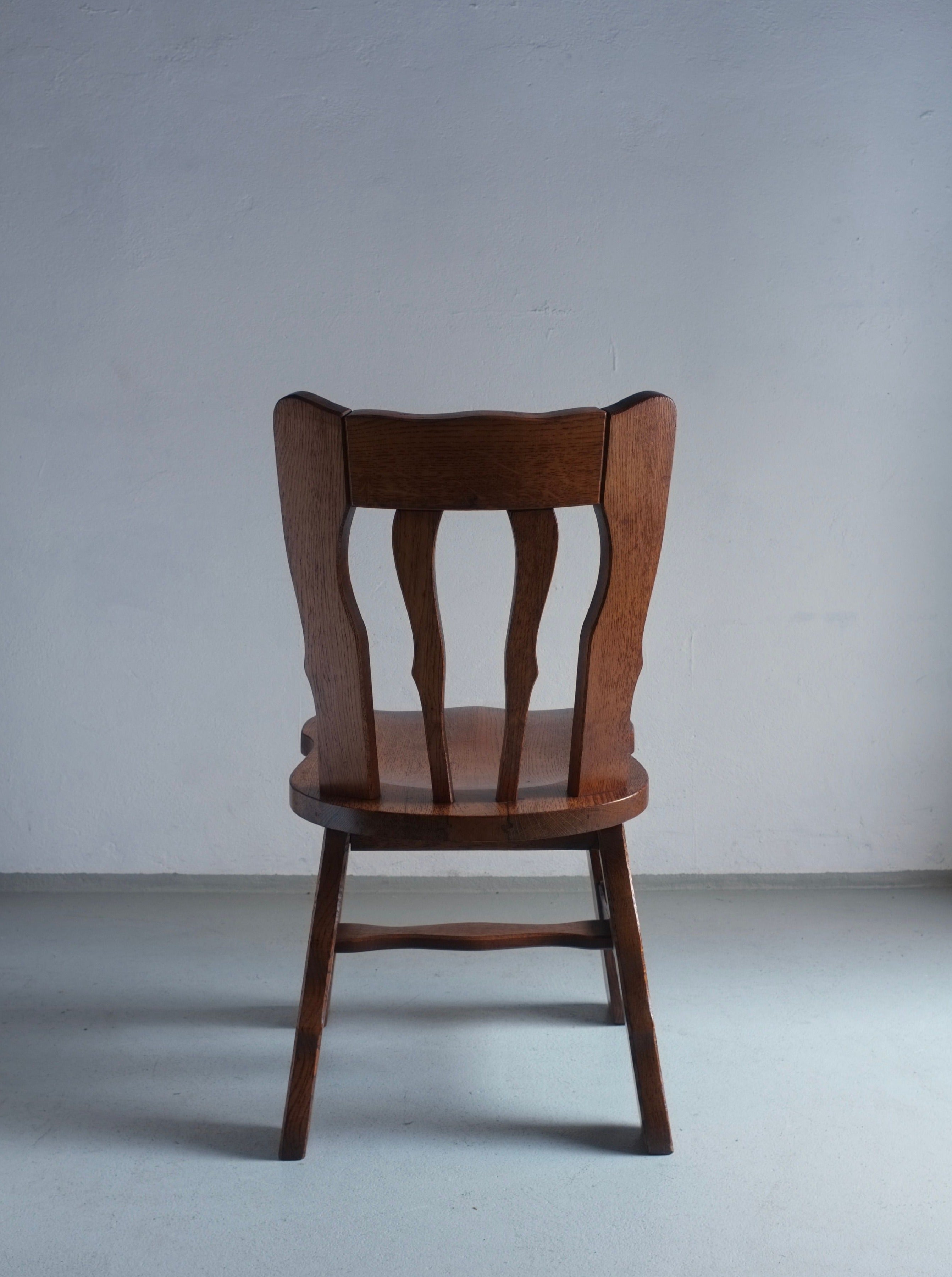 Pair of vintage Brutalist style oak dining chairs from the 1970s