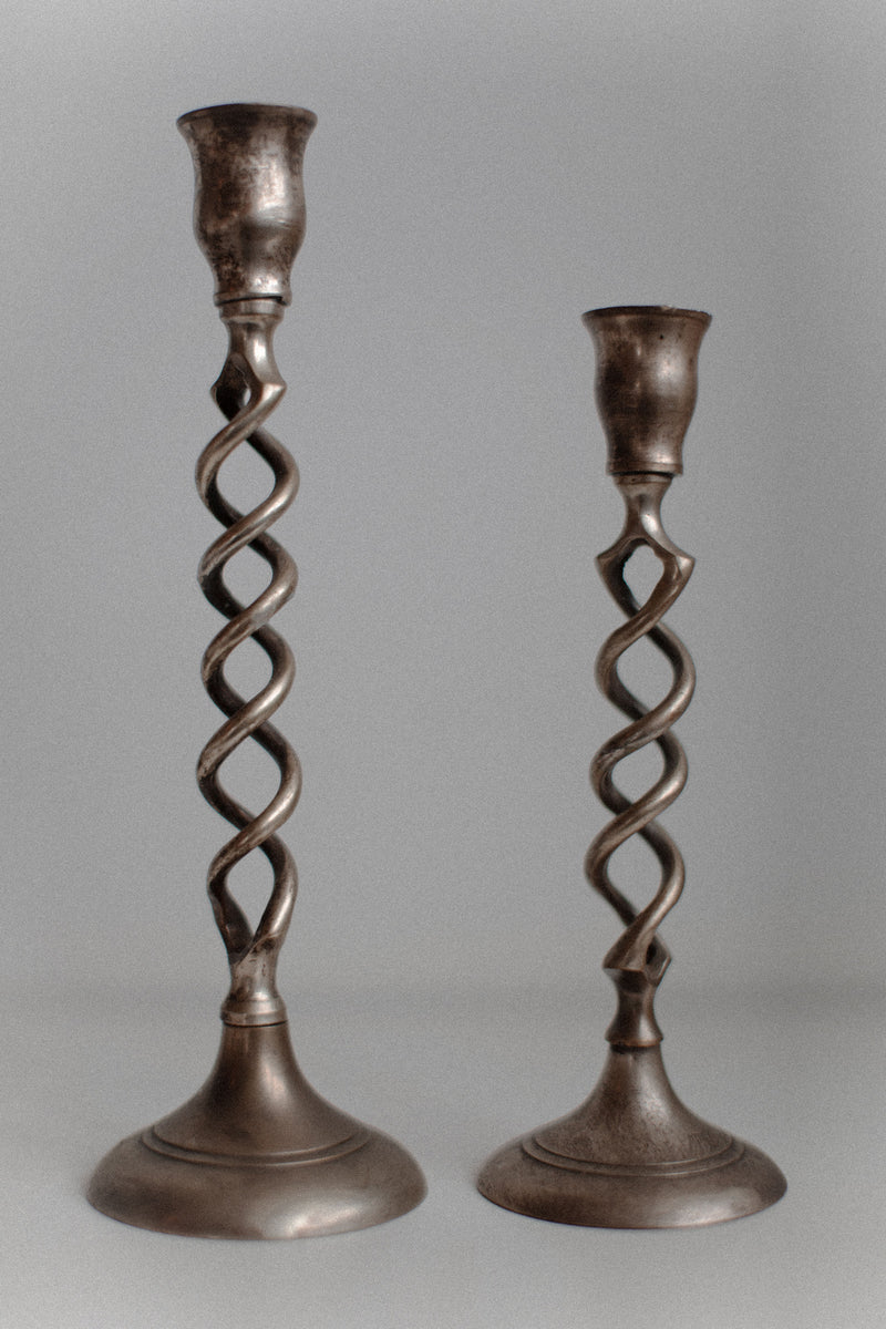 Set of three brass candleholders with twisted features and antique look