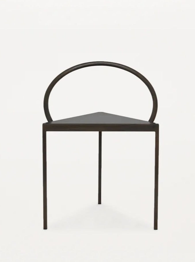 Modern black Triangolo chair with sleek angular design and comfortable seating