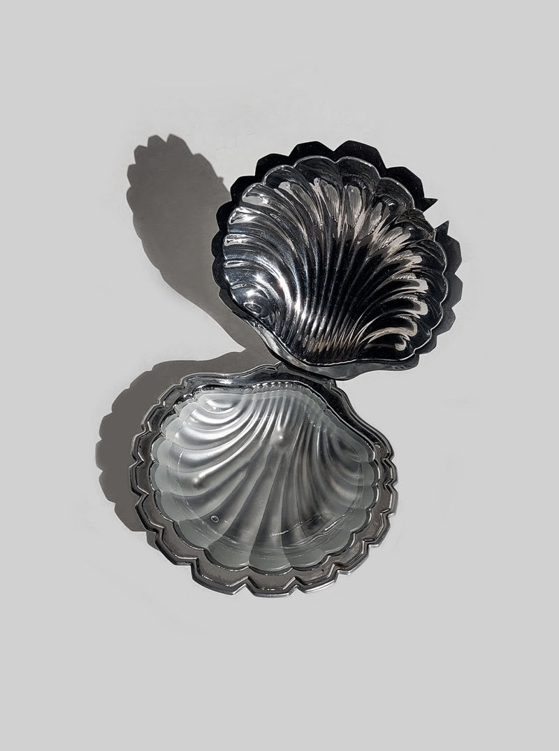 Shell-shaped ceramic butter dish with intricate floral design