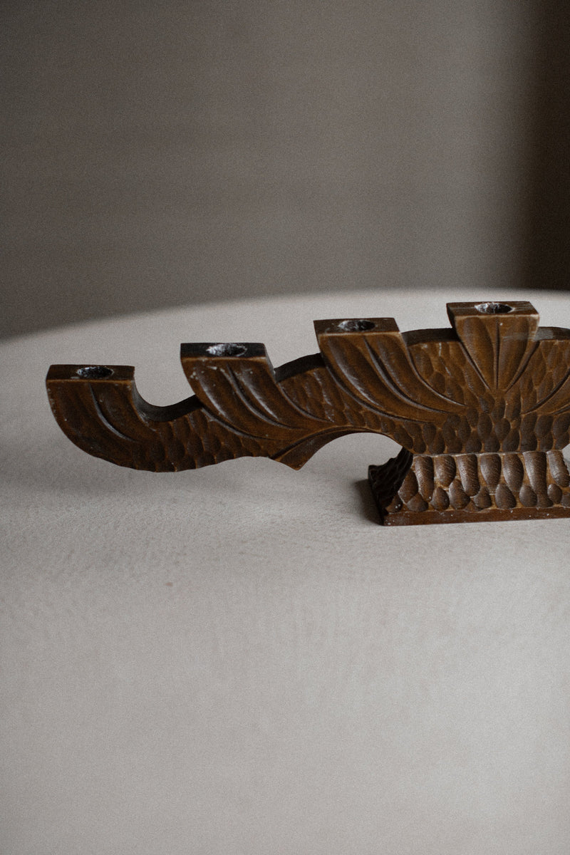 Handcrafted wooden candlestick with elegant design and rustic charm