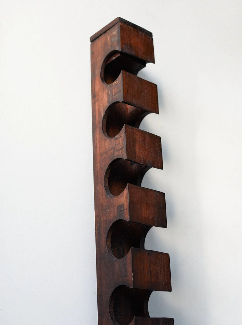 Modern minimalist wine rack made of raw steel and concrete