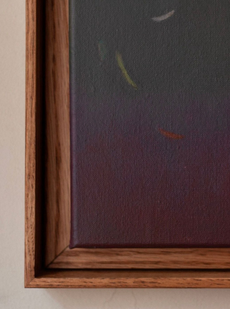 This close-up features "Ponds and Breezes #8, 2023" by Rebecca von Matérn, a wooden-framed canvas with a minimalist gradient background from dark gray to deep maroon. Scattered white, yellow, and red brushstrokes in the top corner enhance its contemporary elegance.