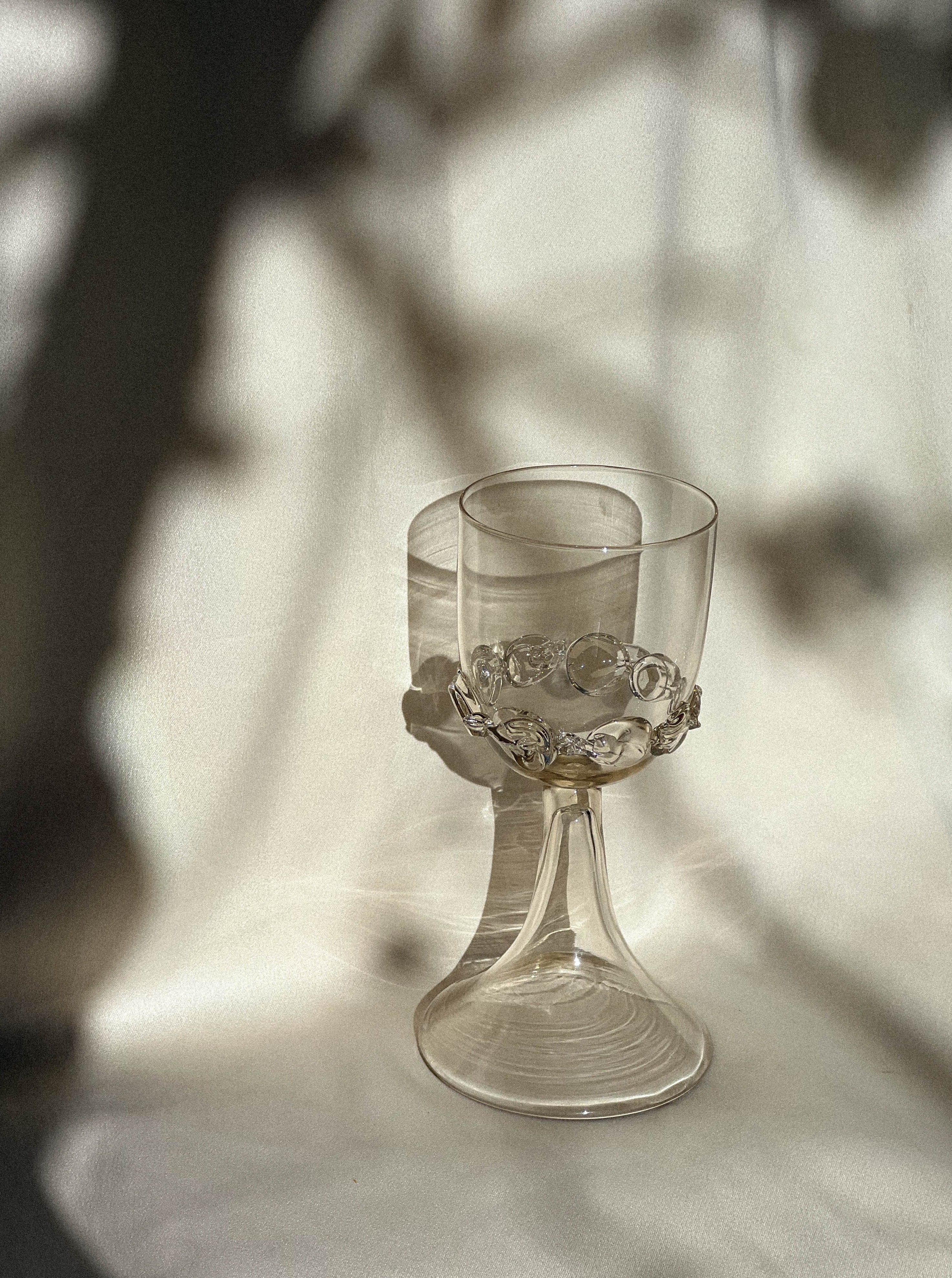 Luxurious wine goblets with handcrafted chain design, making a statement at any formal gathering