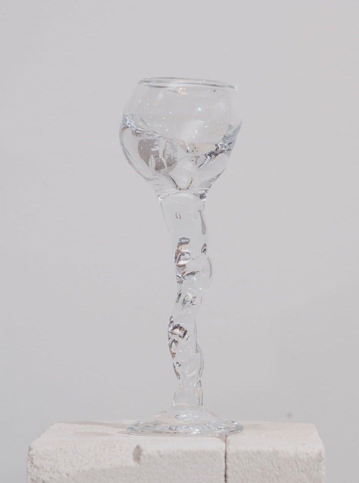 Crystal wine glass with long stem and delicate curves, perfect for fine dining and special occasions